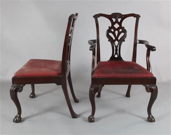 A set of twelve late Victorian Chippendale revival mahogany dining chairs including two carvers,